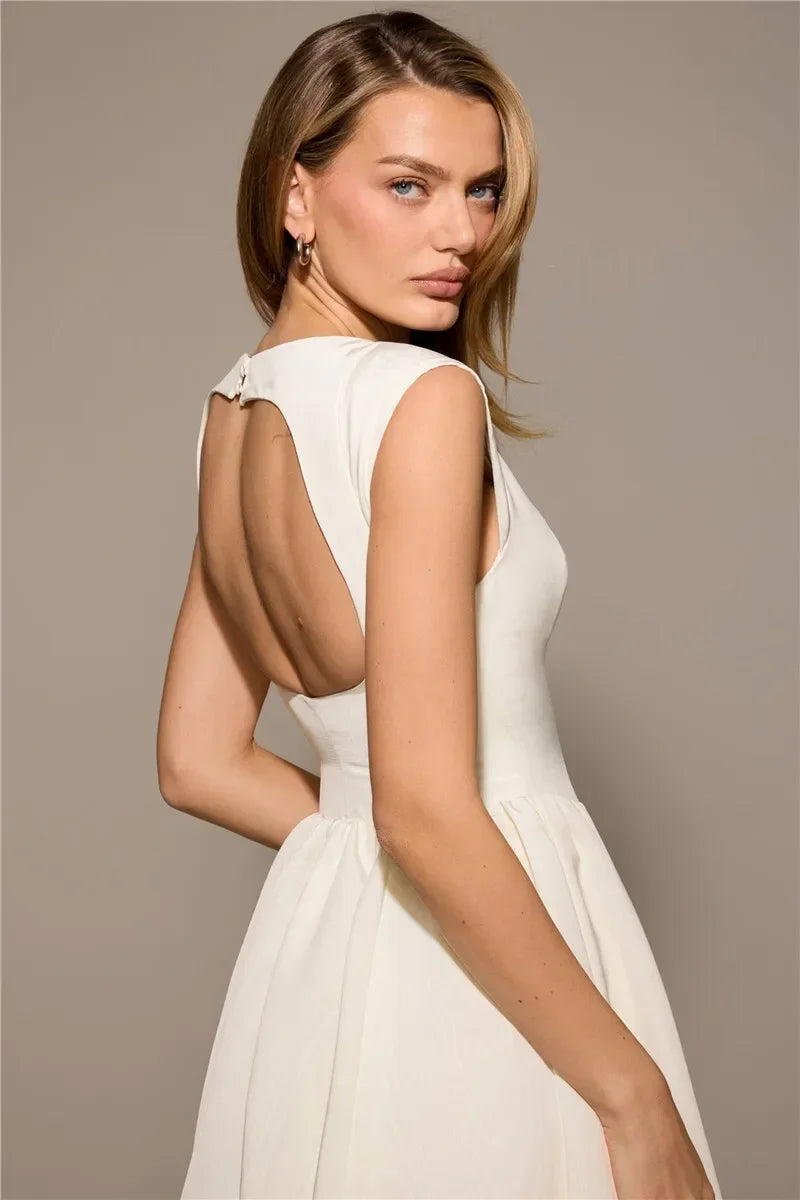Elegant Dress with Cape Sleeve and Open Back