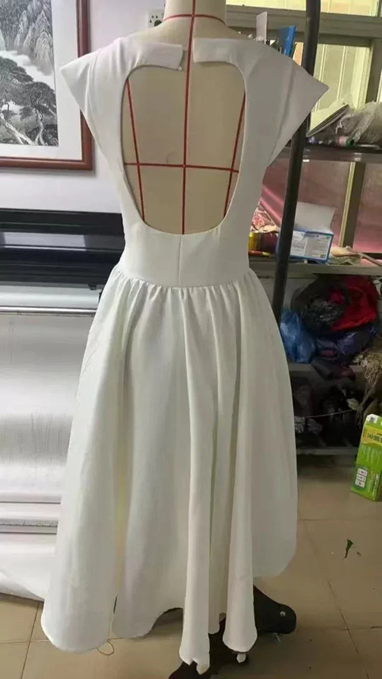 Elegant Dress with Cape Sleeve and Open Back