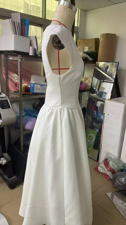 Elegant Dress with Cape Sleeve and Open Back