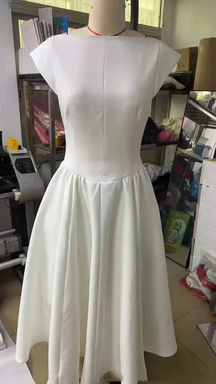 Elegant Dress with Cape Sleeve and Open Back