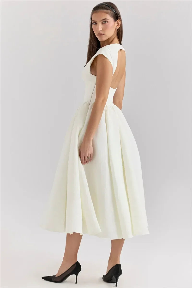 Elegant Dress with Cape Sleeve and Open Back