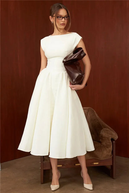 Elegant Dress with Cape Sleeve and Open Back
